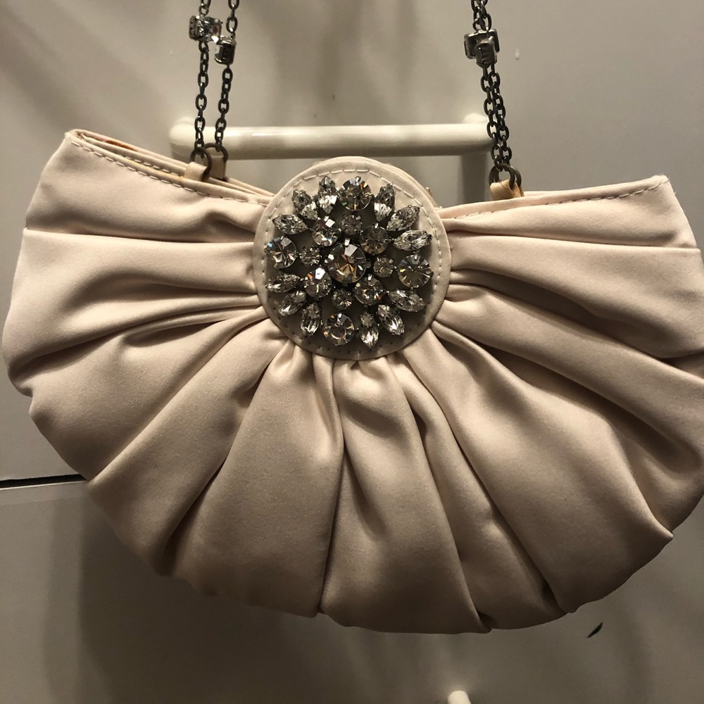 A beautiful evening cream color satin bag